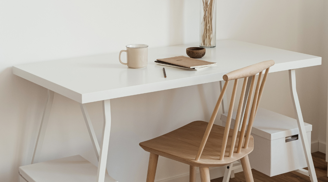 A desk ready for someone to sit and work. Sonrisa Studio shares how to be more strategic with your brand.